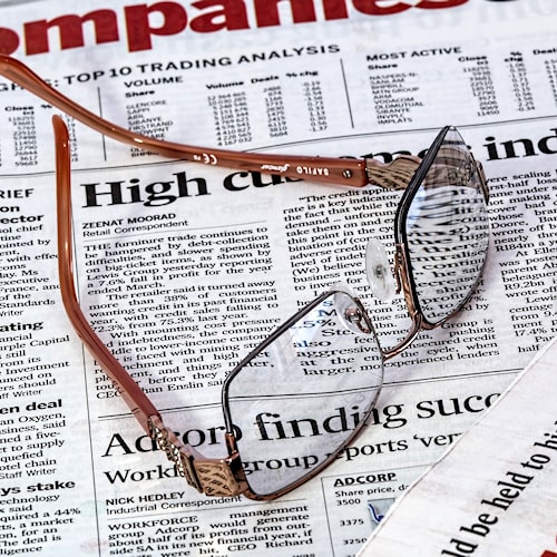 Glasses on the newspaper.